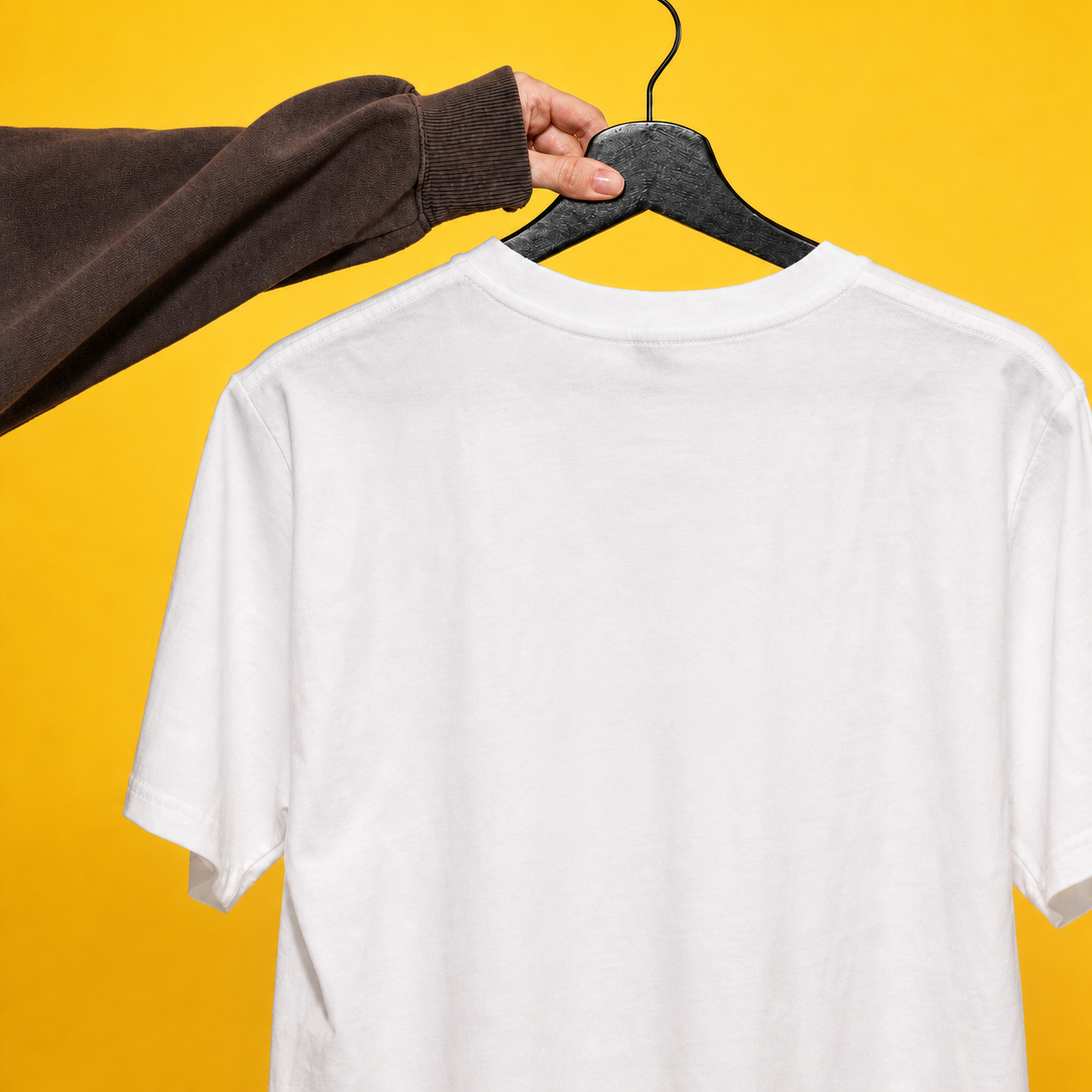 A printed T-shirt before and after its visible lettering is removed.